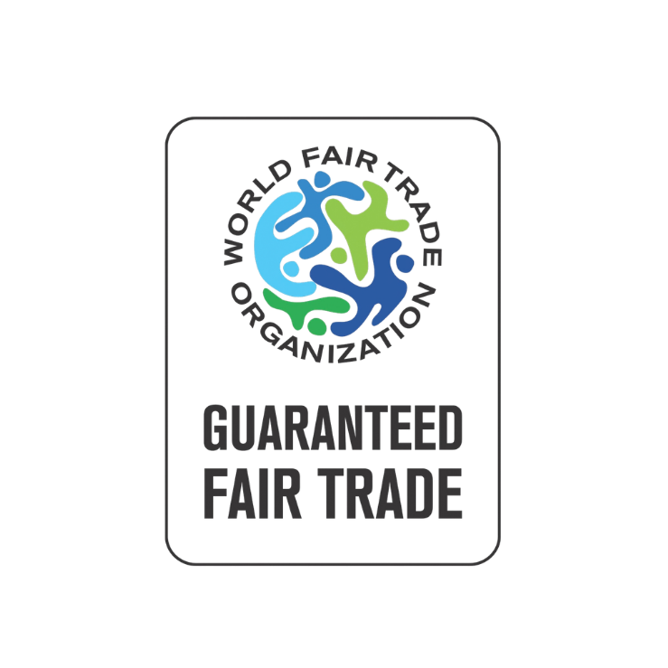 A rectangular certification badge with rounded corners featuring the World Fair Trade Organization logo and the text 'GUARANTEED FAIR TRADE' on a plain white background.